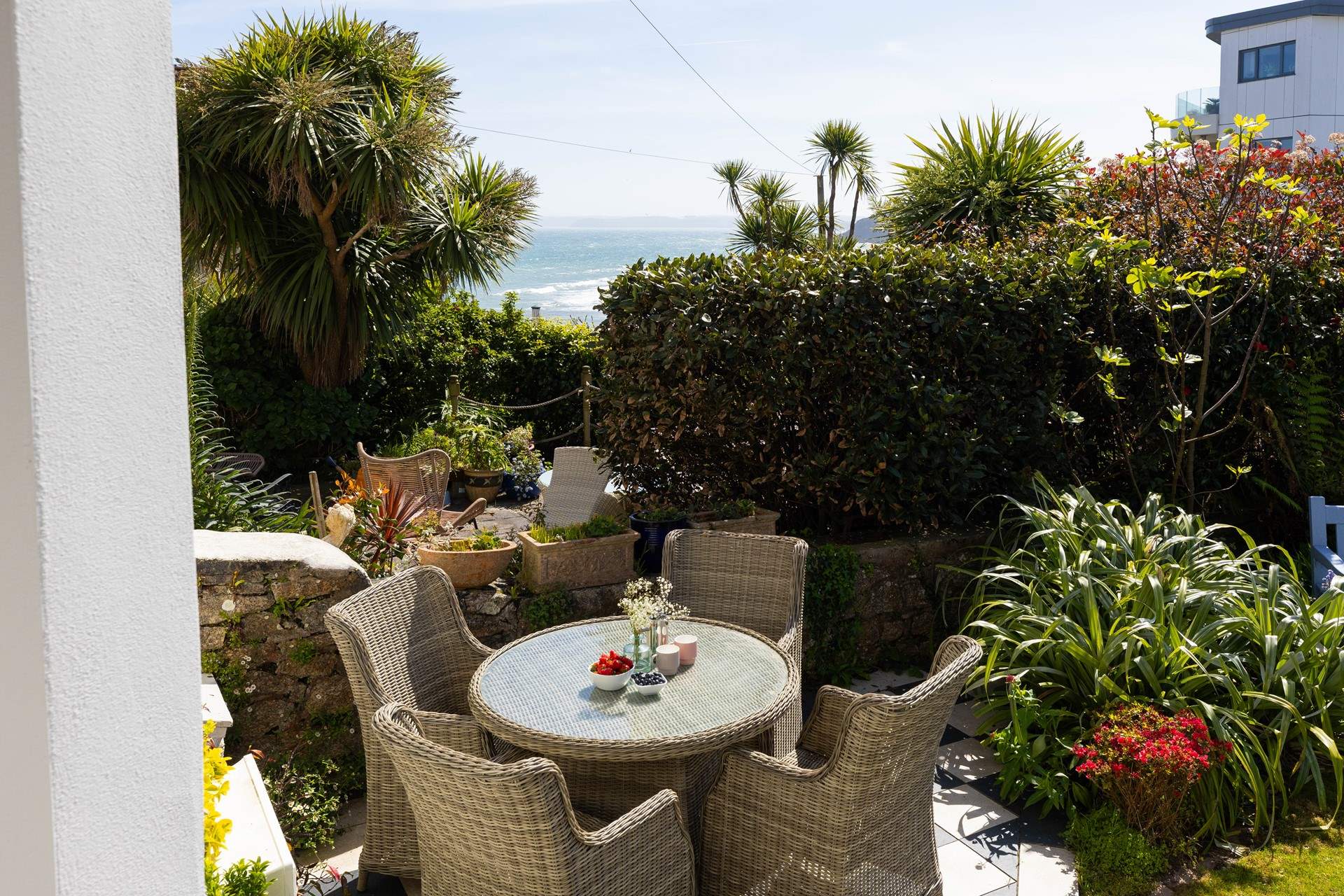 Sea glimpse from the sheltered sunny front garden. 