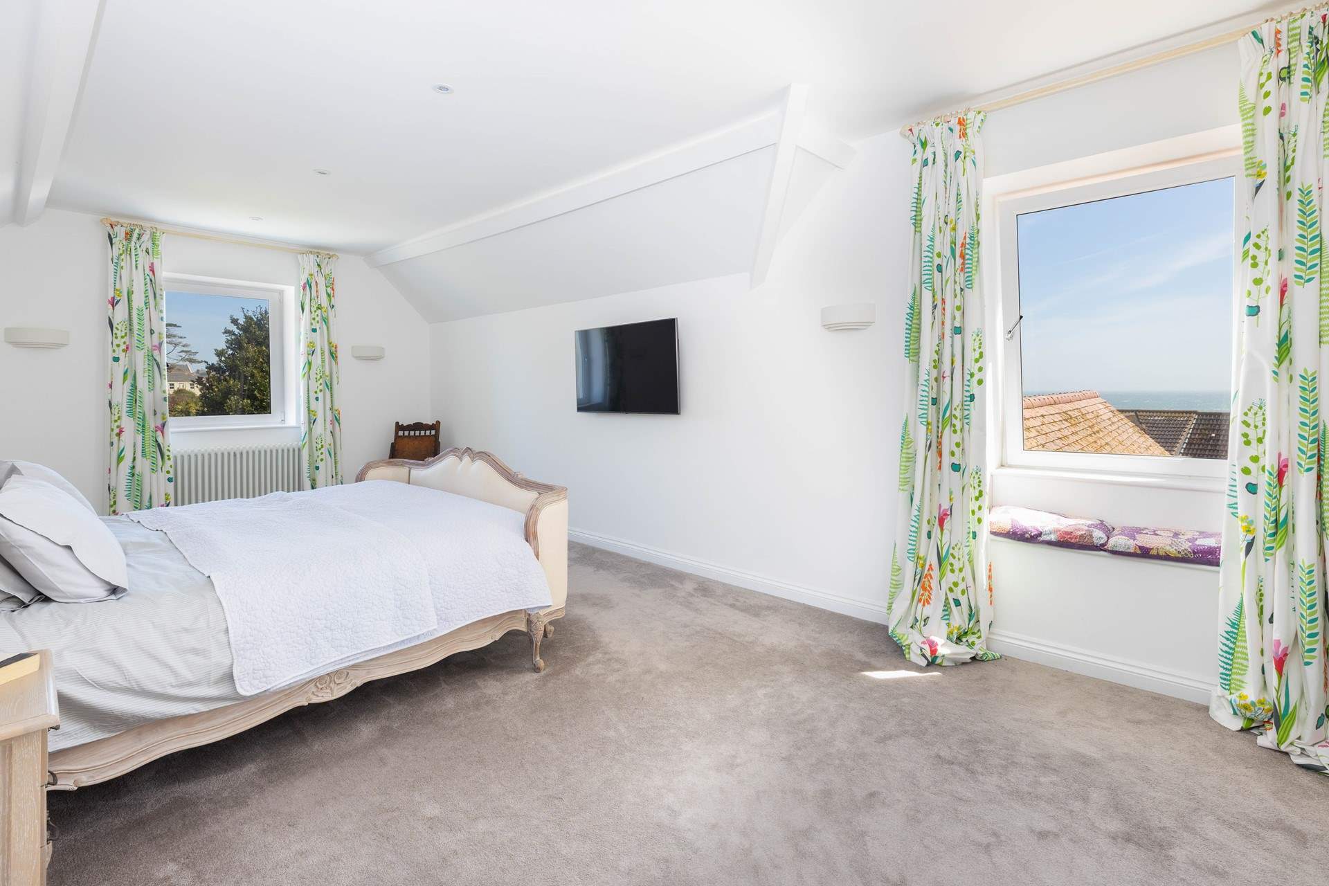 This large bedroom has far reaching views over the sea. 