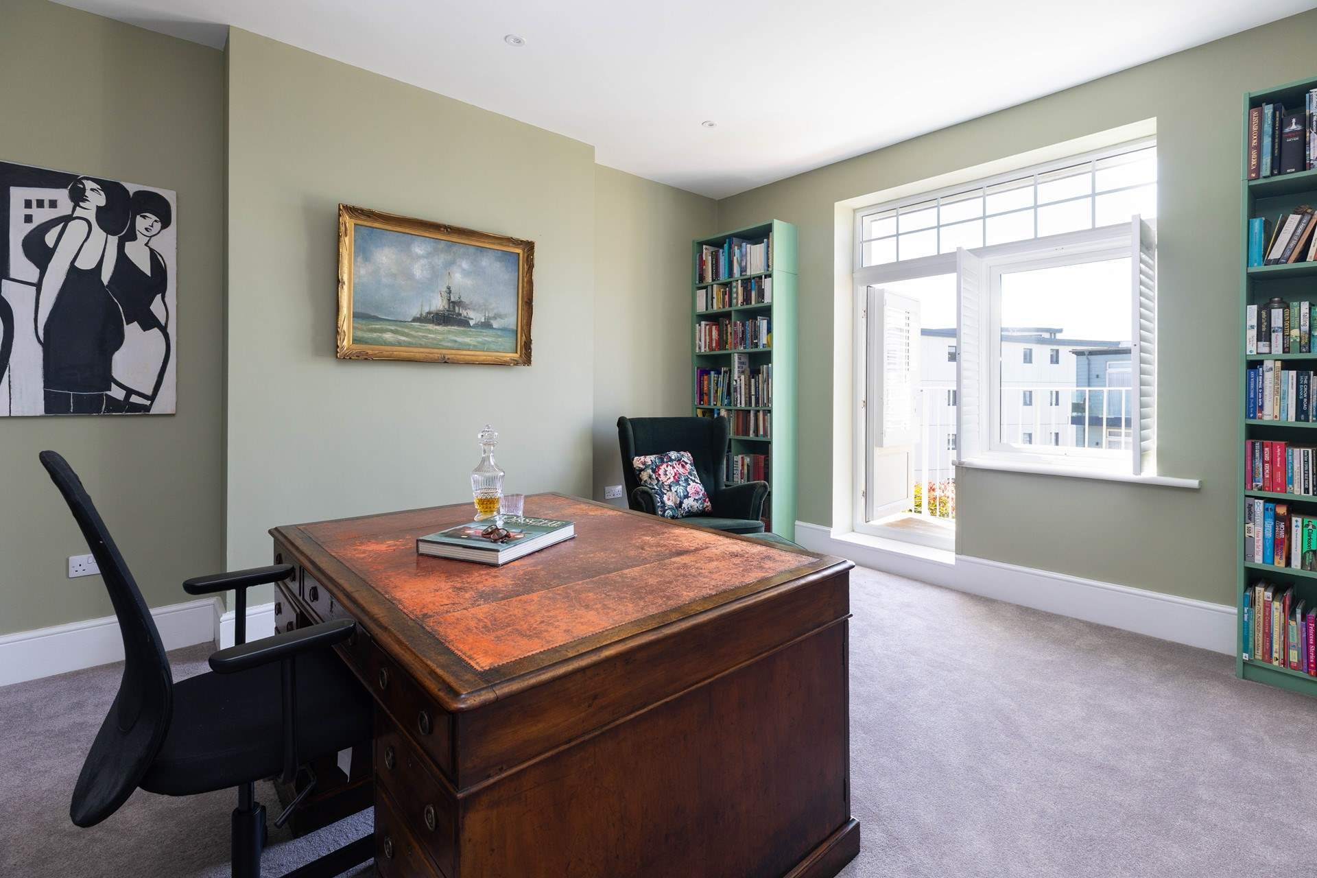 The door opens to the balcony with views over Gylly beach and out to sea. 