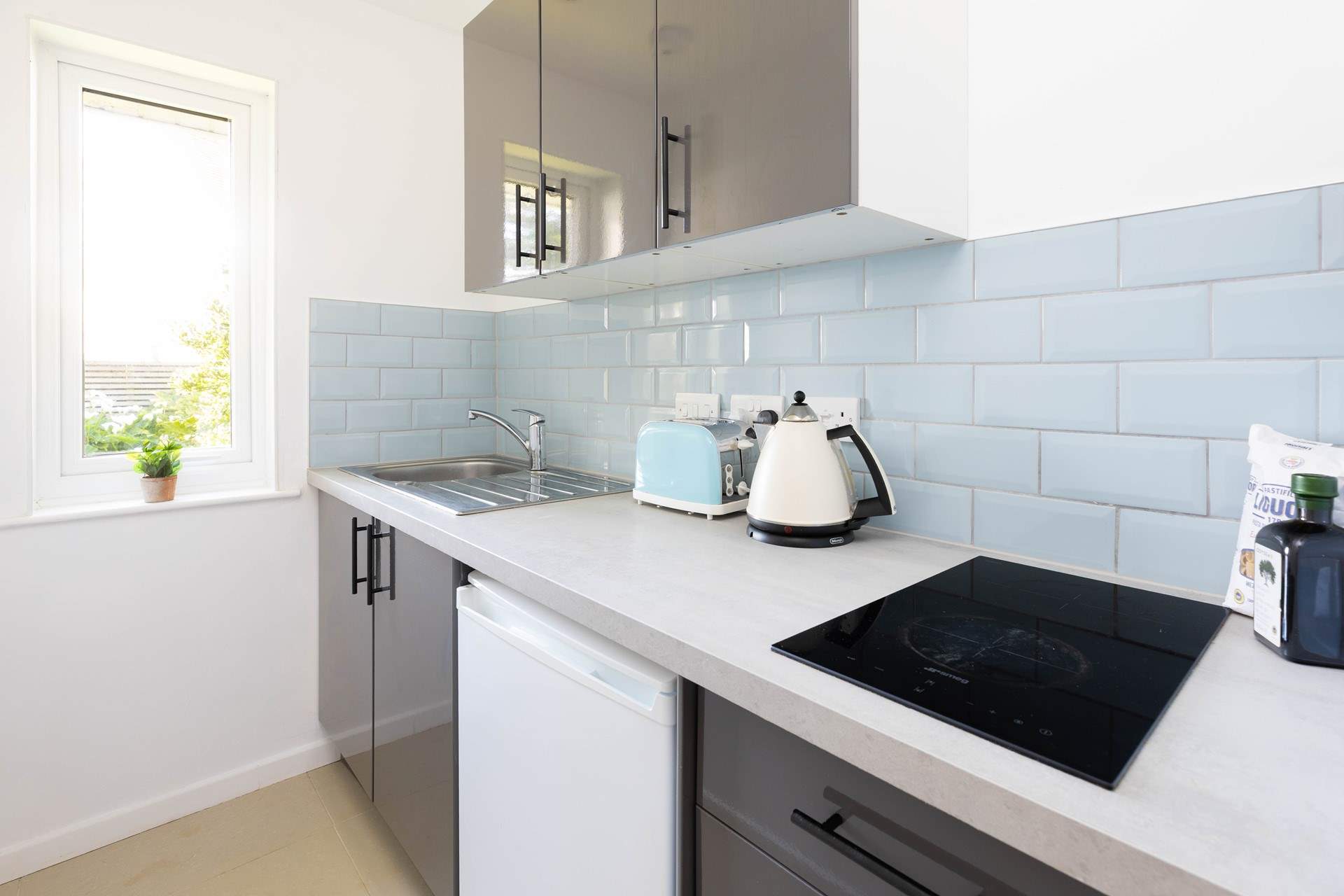 The small kitchen has a two ring hob, toaster and kettle. 