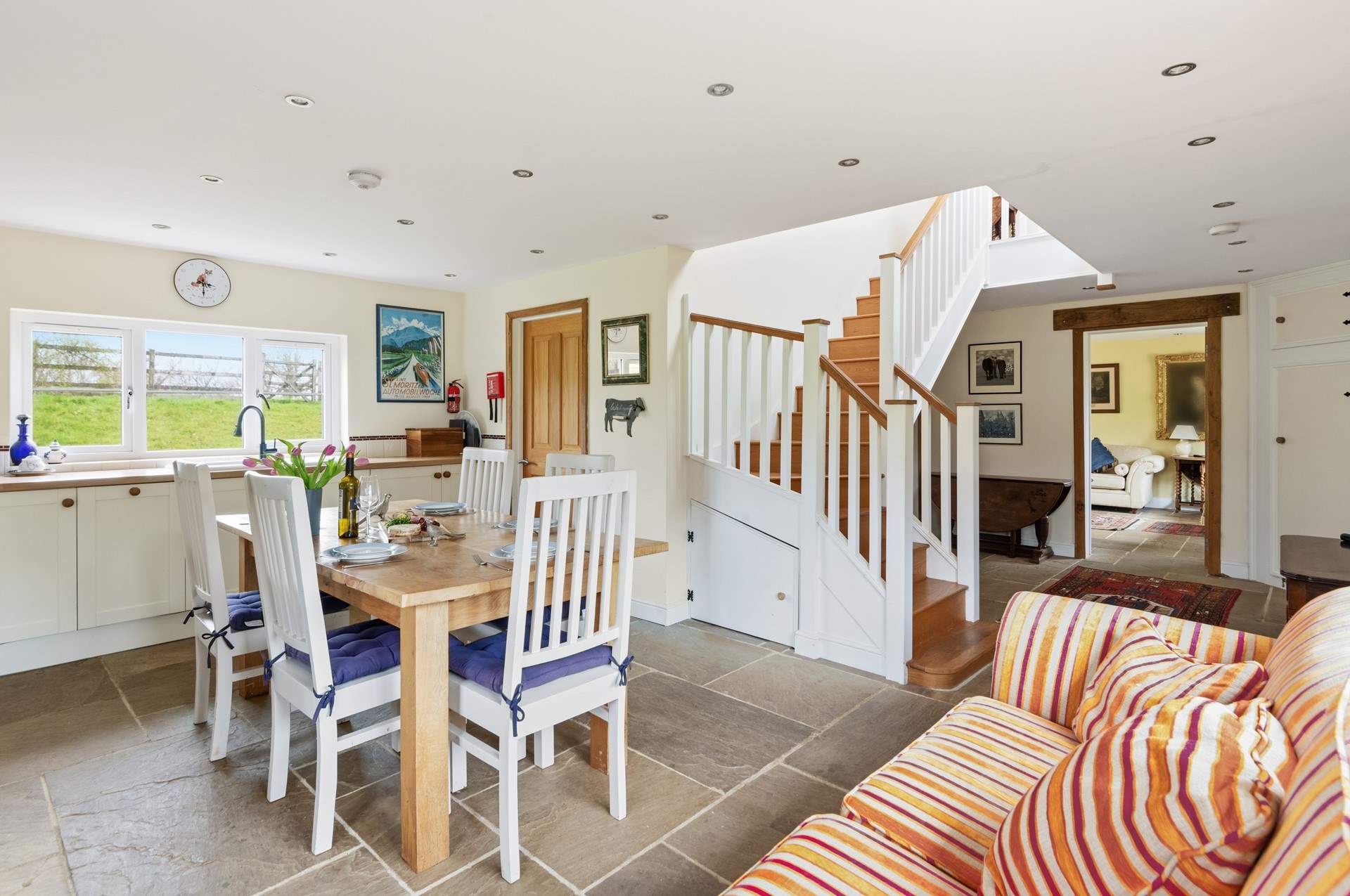 Looking back from the kitchen into the hallway and through to the sitting-room.