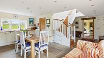 Looking back from the kitchen into the hallway and through to the sitting-room.