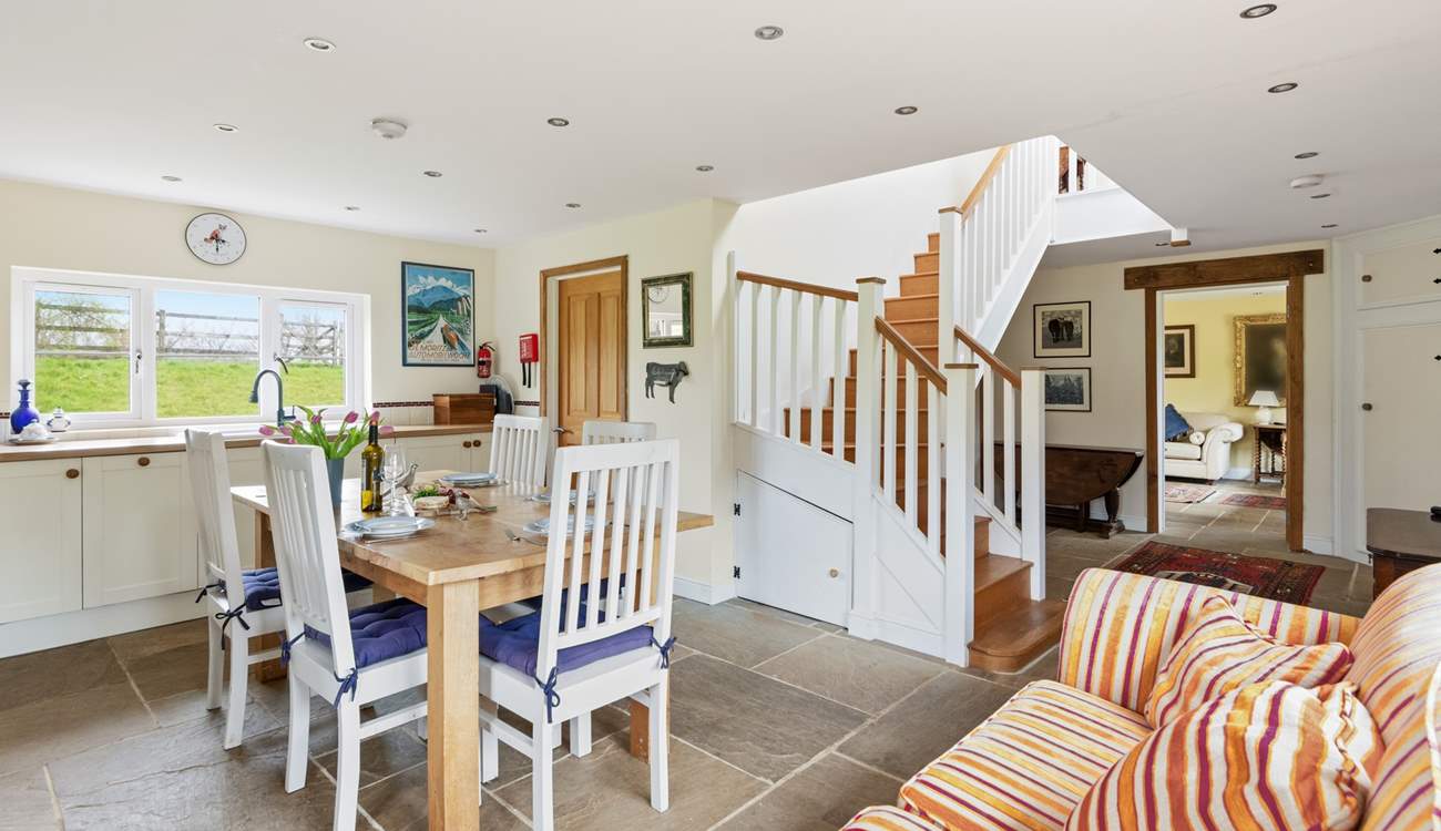 Looking back from the kitchen into the hallway and through to the sitting-room.