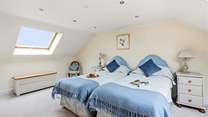 Bedroom 2 is home to this charming twin configuration.