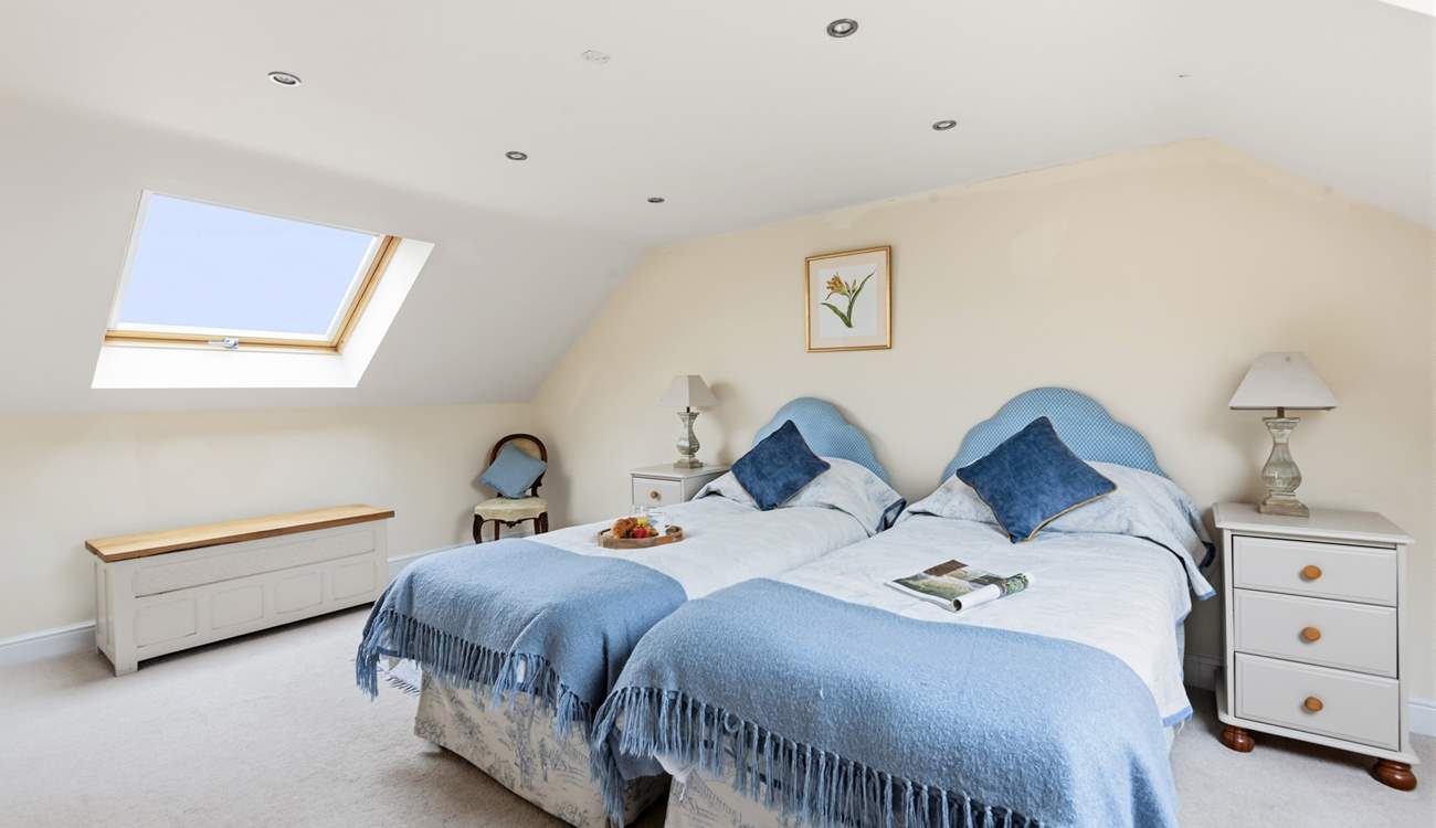 Bedroom 2 is home to this charming twin configuration.