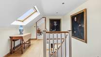 The first floor landing links the two bedrooms. A bedroom at each end of the hallway.