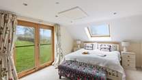 Bedroom one is a super-king bedroom which oozes comfort and style, with superb countryside views too.
