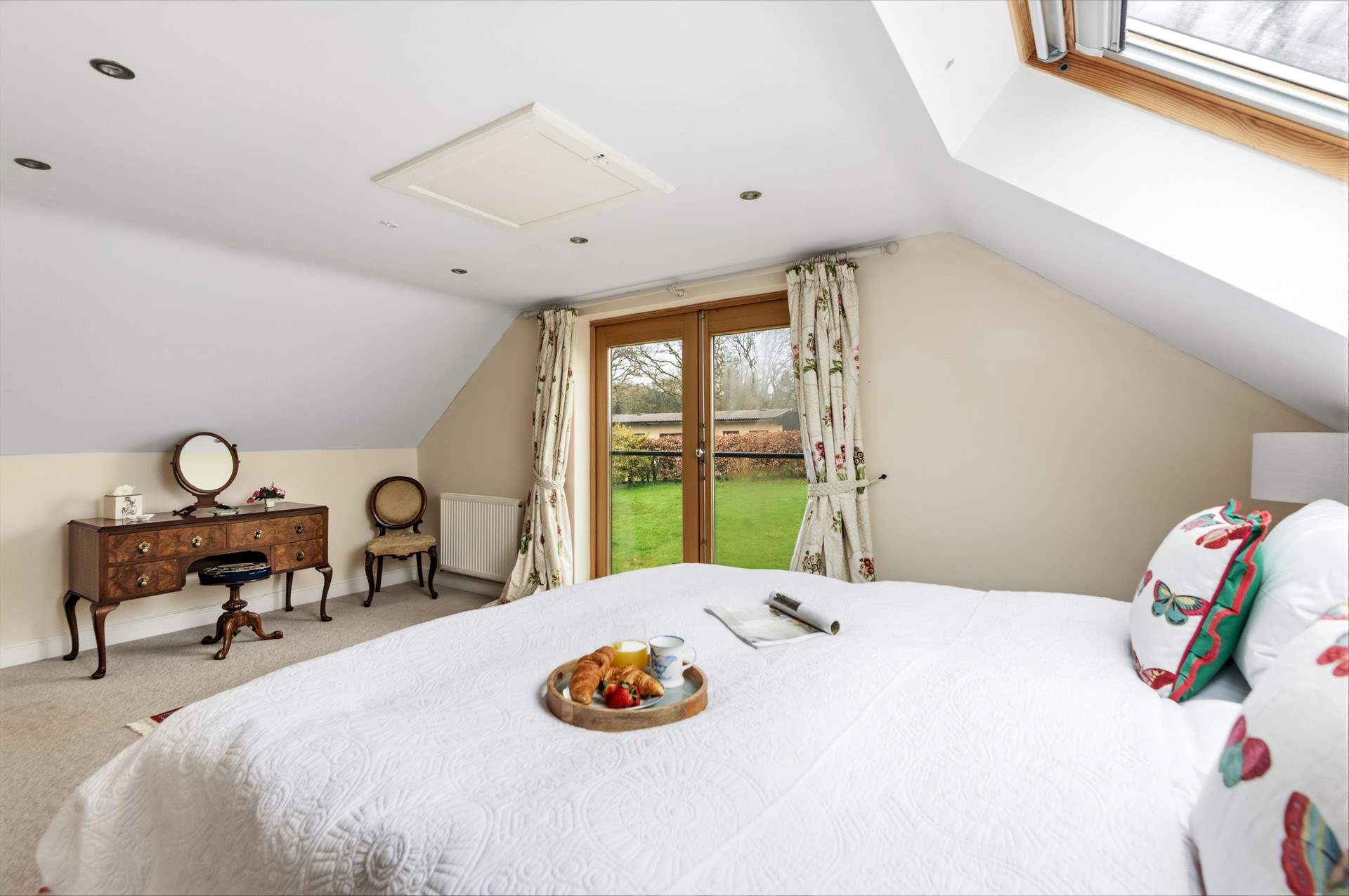 Bedroom 1 is super spacious and airy with delightful countryside views.