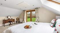 Bedroom 1 is super spacious and airy with delightful countryside views.