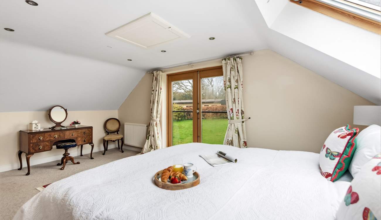 Bedroom 1 is super spacious and airy with delightful countryside views.