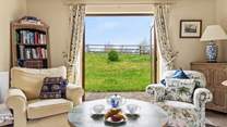 Step out of the sitting-room onto your patio to enjoy the fresh Devon air.