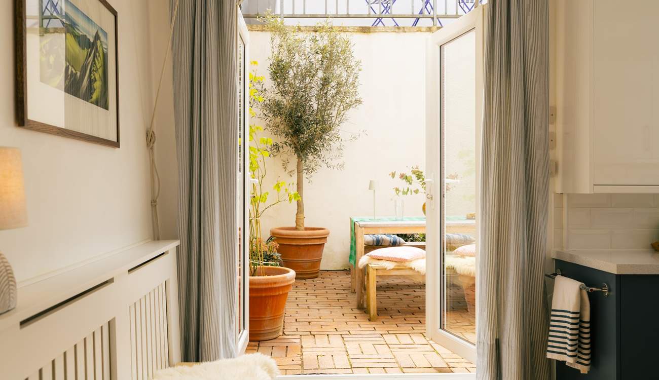 Open the doors and bring the outside in.