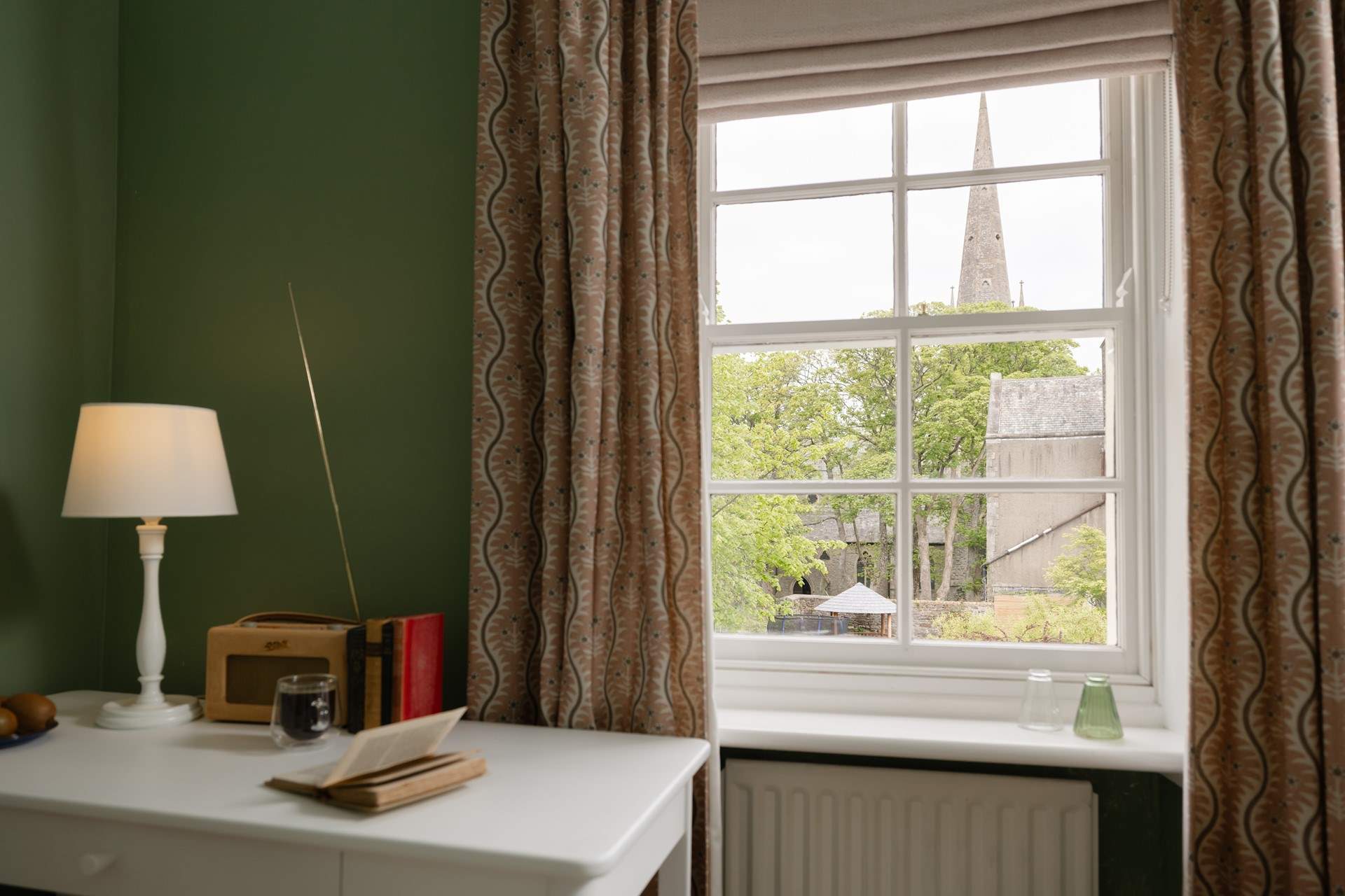 Gaze at the view to the church while catching up on your reading list.