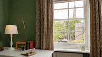 Gaze at the view to the church while catching up on your reading list.