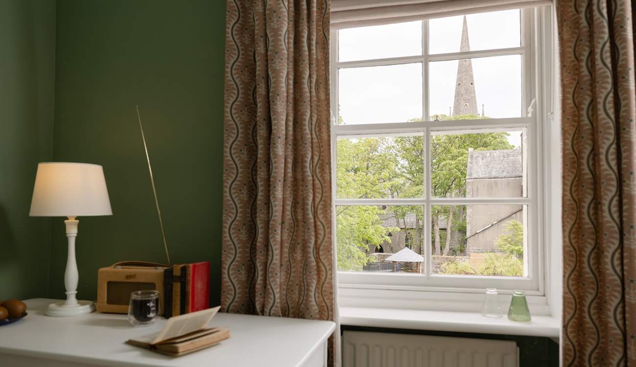 Gaze at the view to the church while catching up on your reading list.