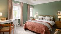 Bedroom 1 is charming and designed to retain its original character.