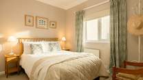 Bedroom 2 has a cosy cottage feel.