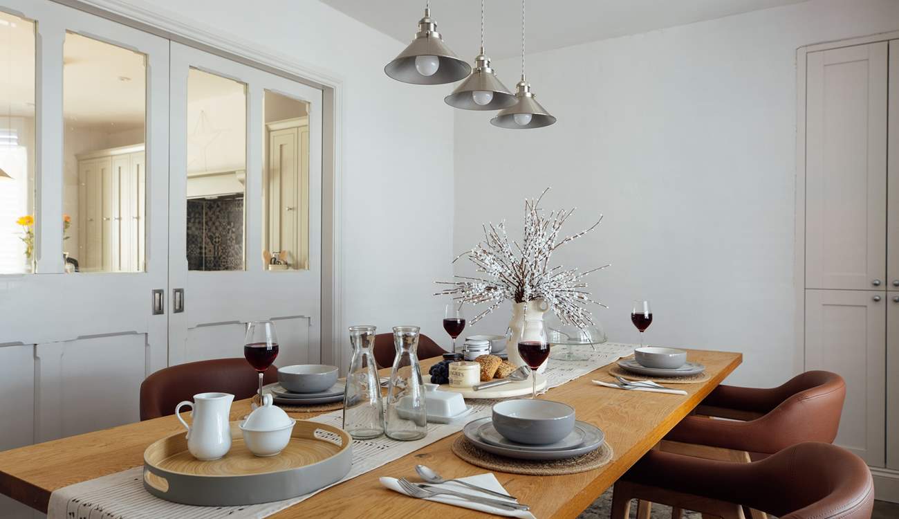 The quiet, understated elegance in the dining-room, enhanced by ambient lighting, soft tones and comfortable chairs. Perfect place to linger with friends and family. 
