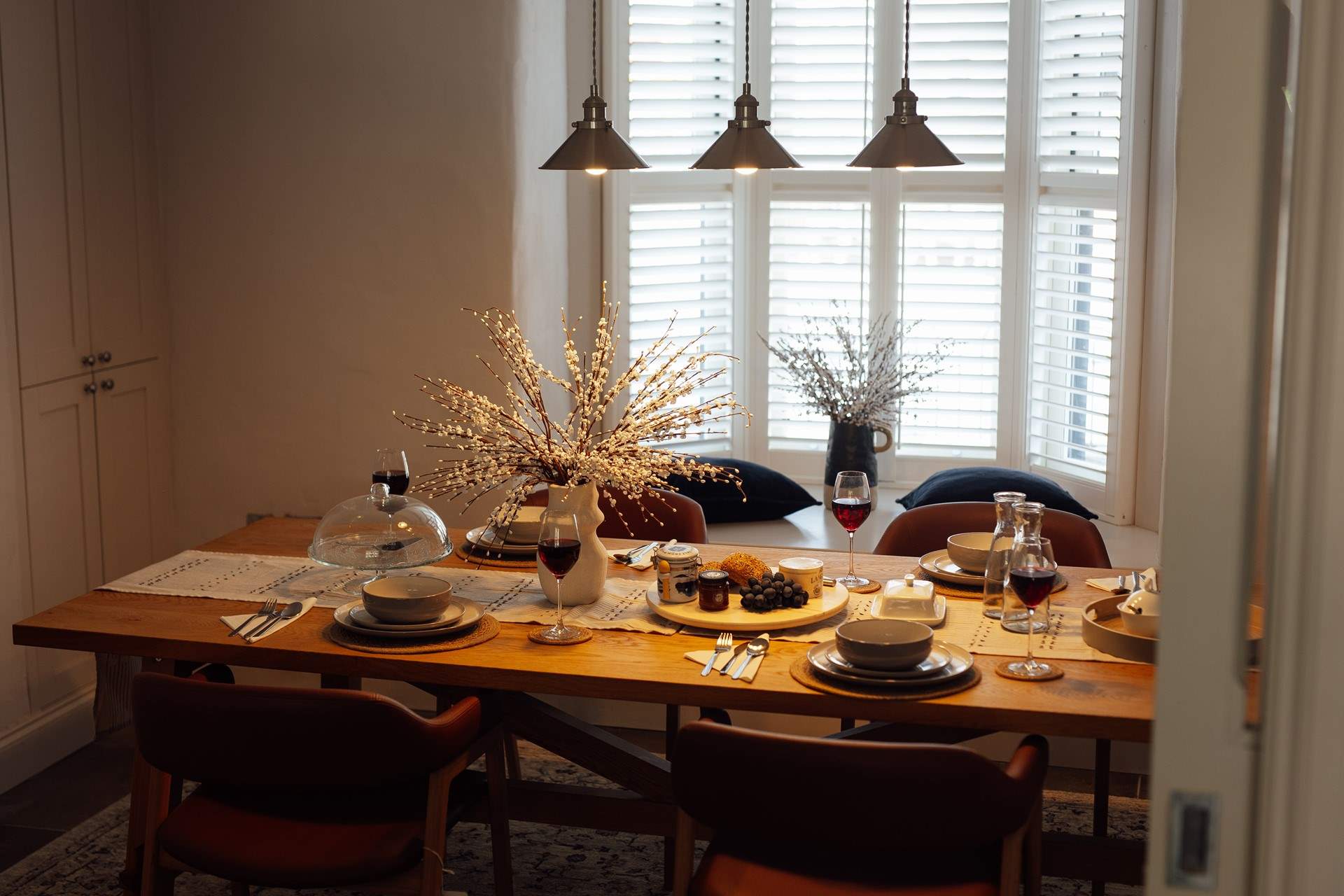 Sunlight gently filters in creating warmth and a soft, welcoming vibe. 