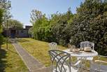 The south-facing garden is ideal for al fresco dining.