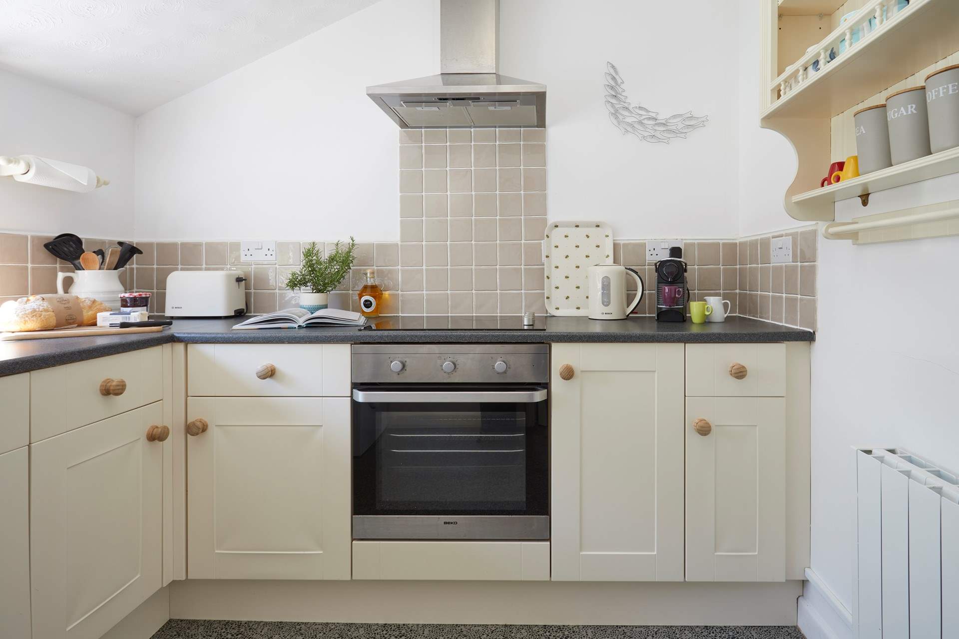 The homely kitchen is well-equipped with everything you need.