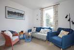 The light and bright cosy sitting-room.