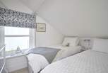 The twin bedroom is fresh and bright - please mind your head on the sloping ceilings.