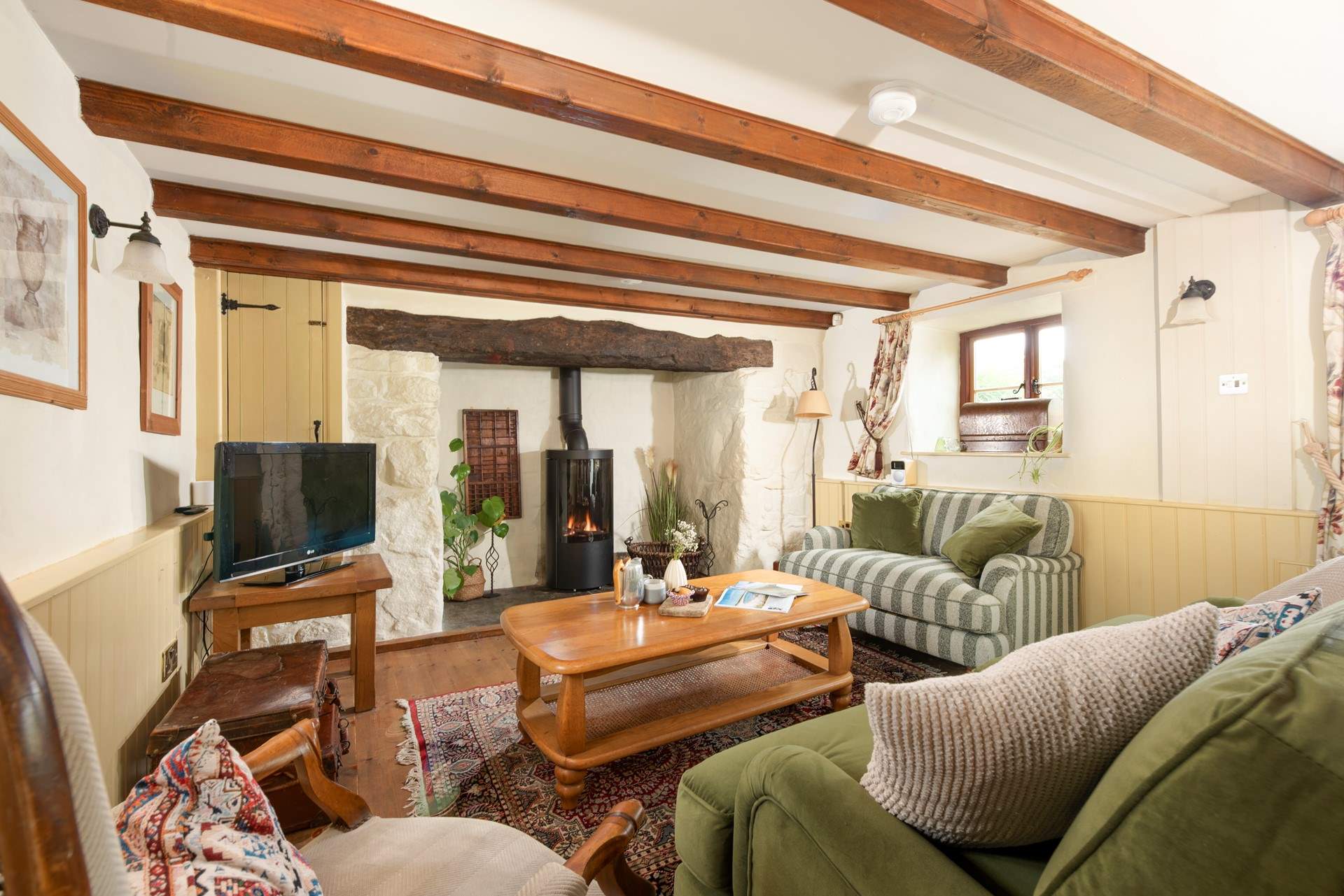 Sink into the comfort of this cosy sitting-room.