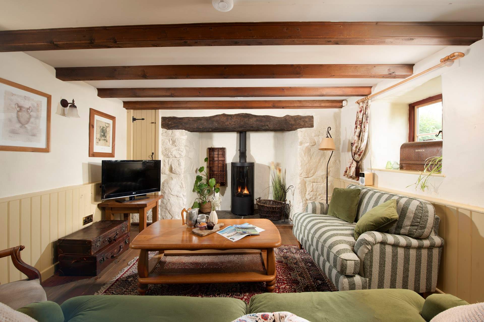 The second sitting-room is full of warmth and character, enjoy a relaxed evening under the beams.