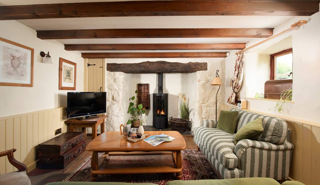 The second sitting-room is full of warmth and character, enjoy a relaxed evening under the beams.