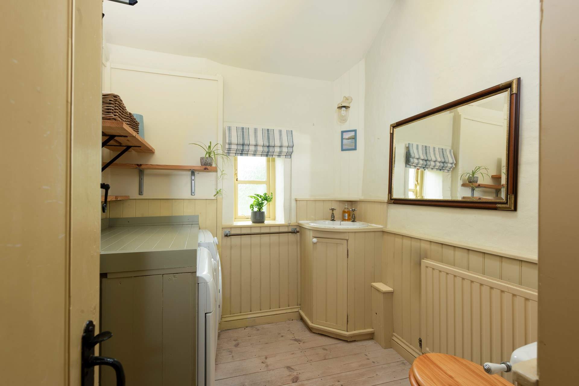 The convenient downstairs cloakroom/utility-room.