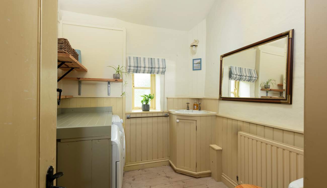 The convenient downstairs cloakroom/utility-room.