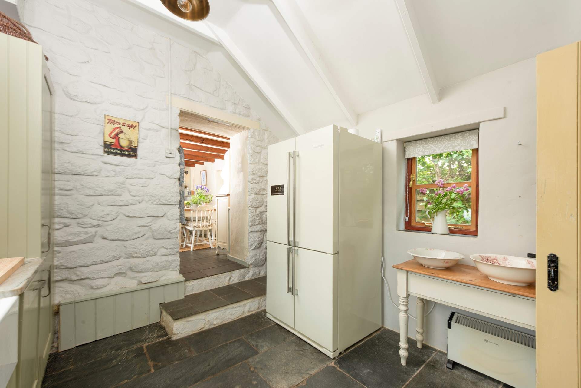 Plenty of fridge space here! Mind the steps from the kitchen.