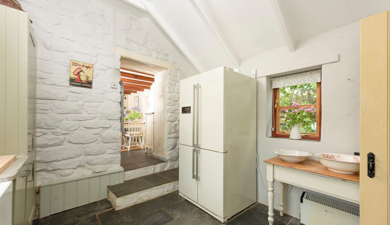 Plenty of fridge space here! Mind the steps from the kitchen.