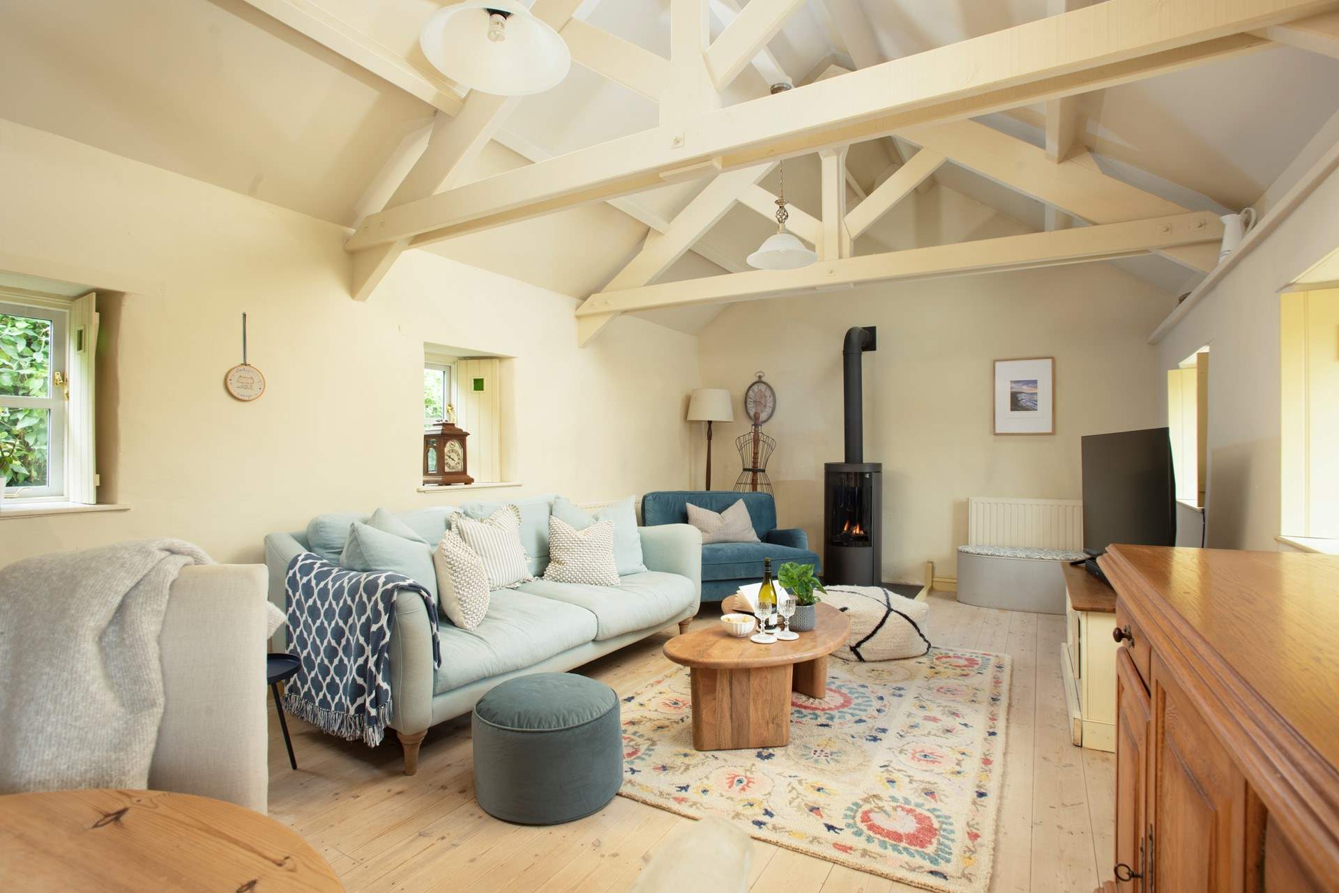 The first cosy sitting-room with gas effect wood-burner.