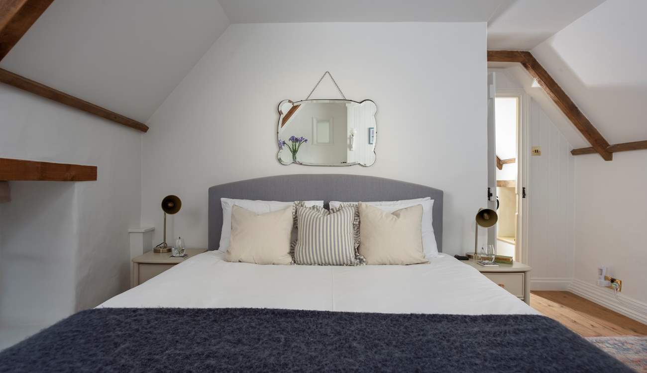 Retreat to this lovely room for a restful night's sleep in king-size bedroom 1.