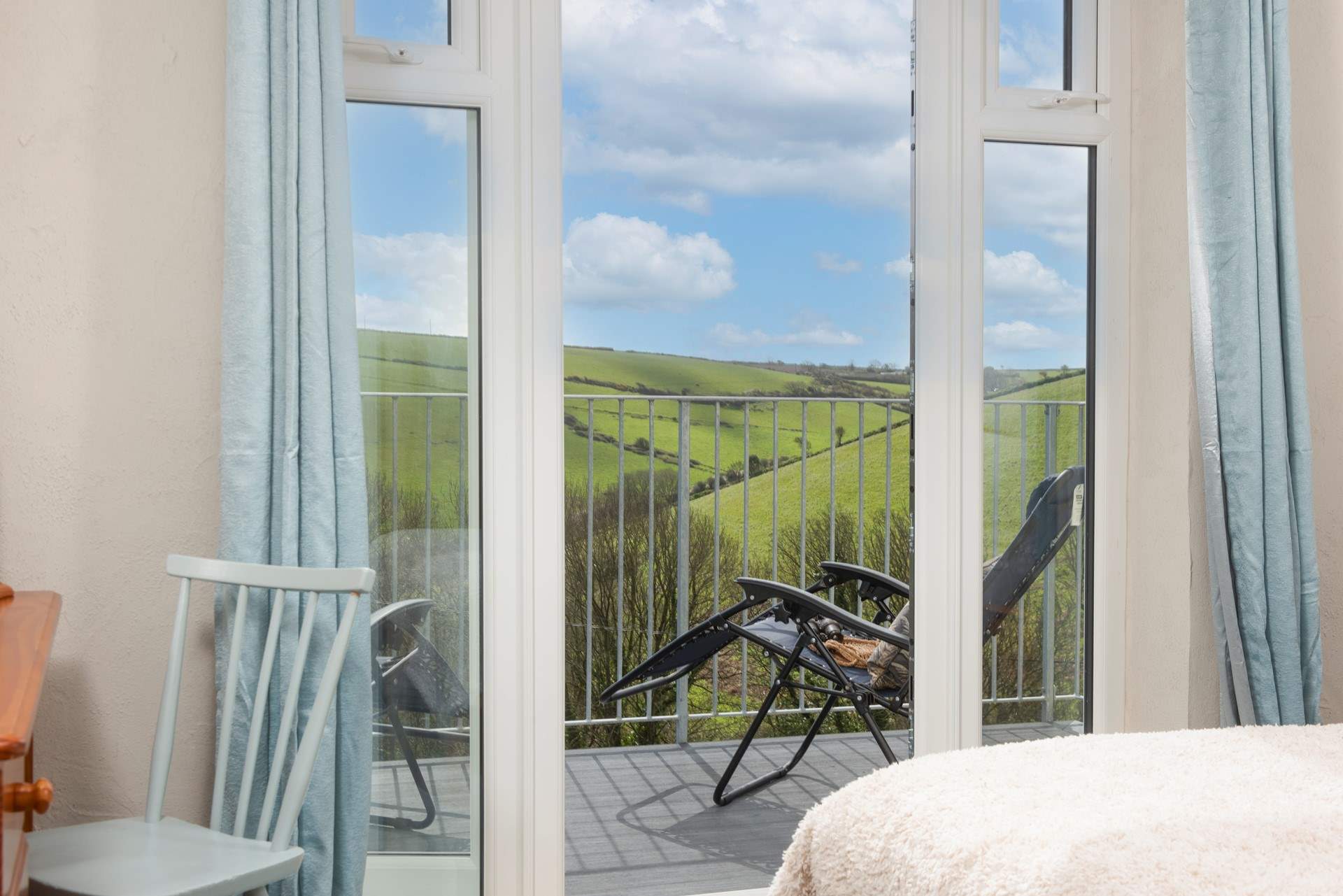 The patio door leads out to the balcony.