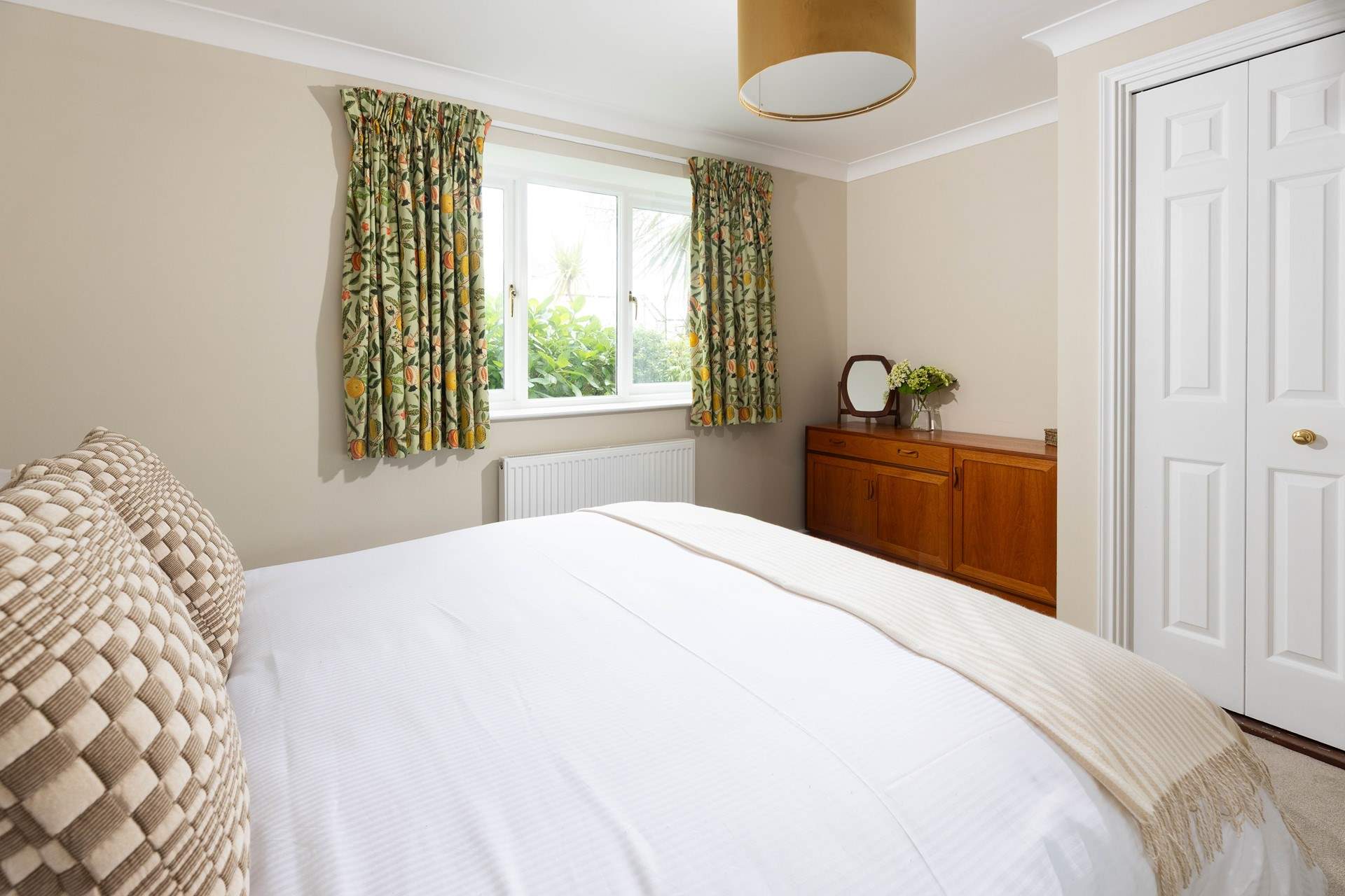 This lovely bedroom has a king size bed. 