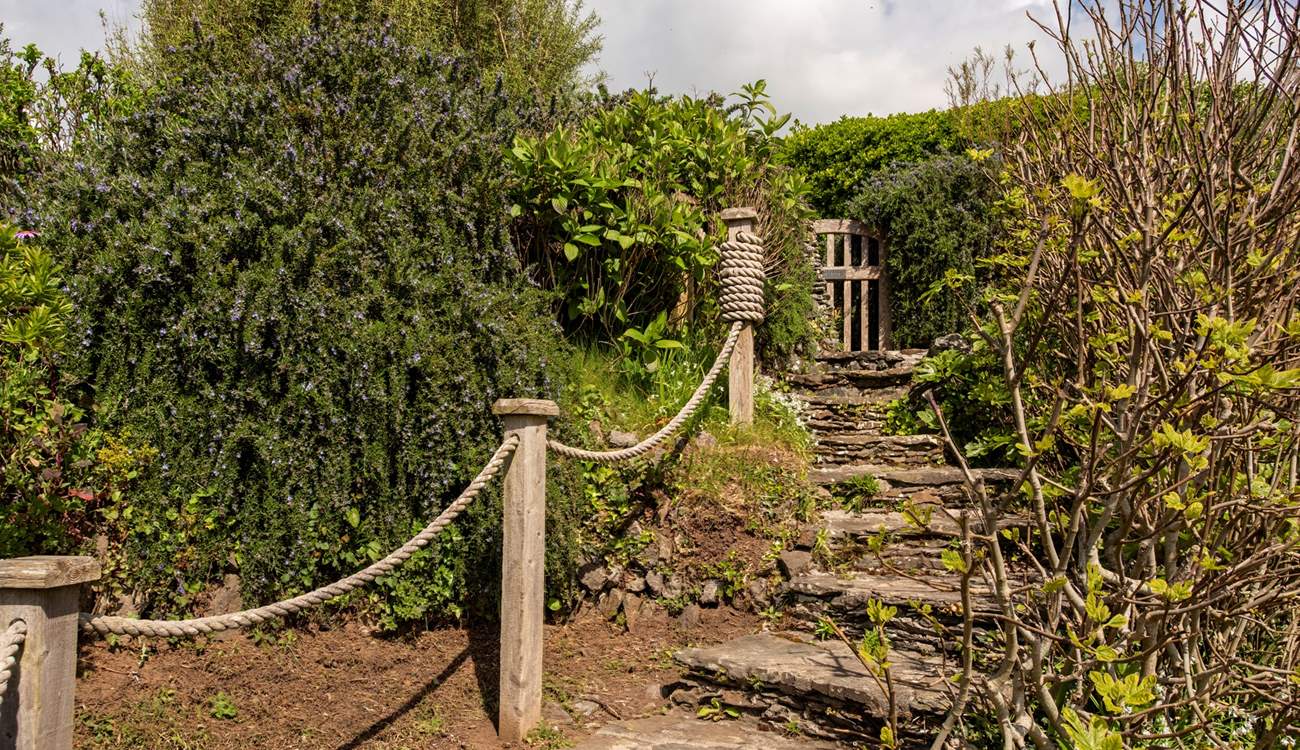 The steps from the garden gate to access the pathway to the beach.