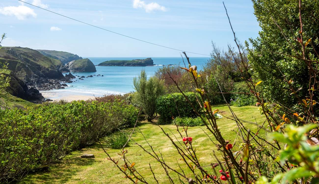 The view of the beach from the lower garden sitting-area.