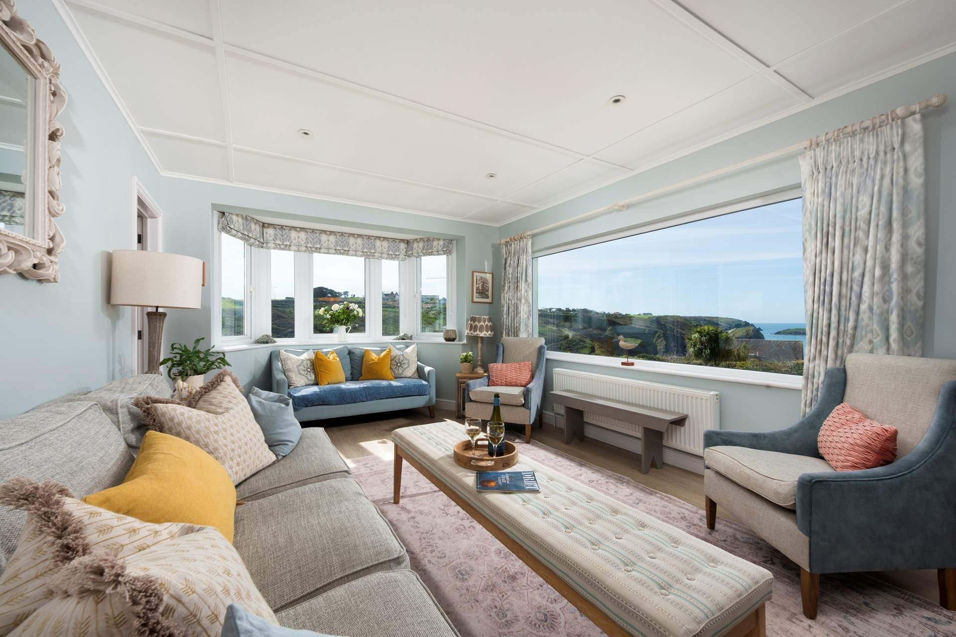 The sitting-room boasts enormous windows to frame the gorgeous backdrop.