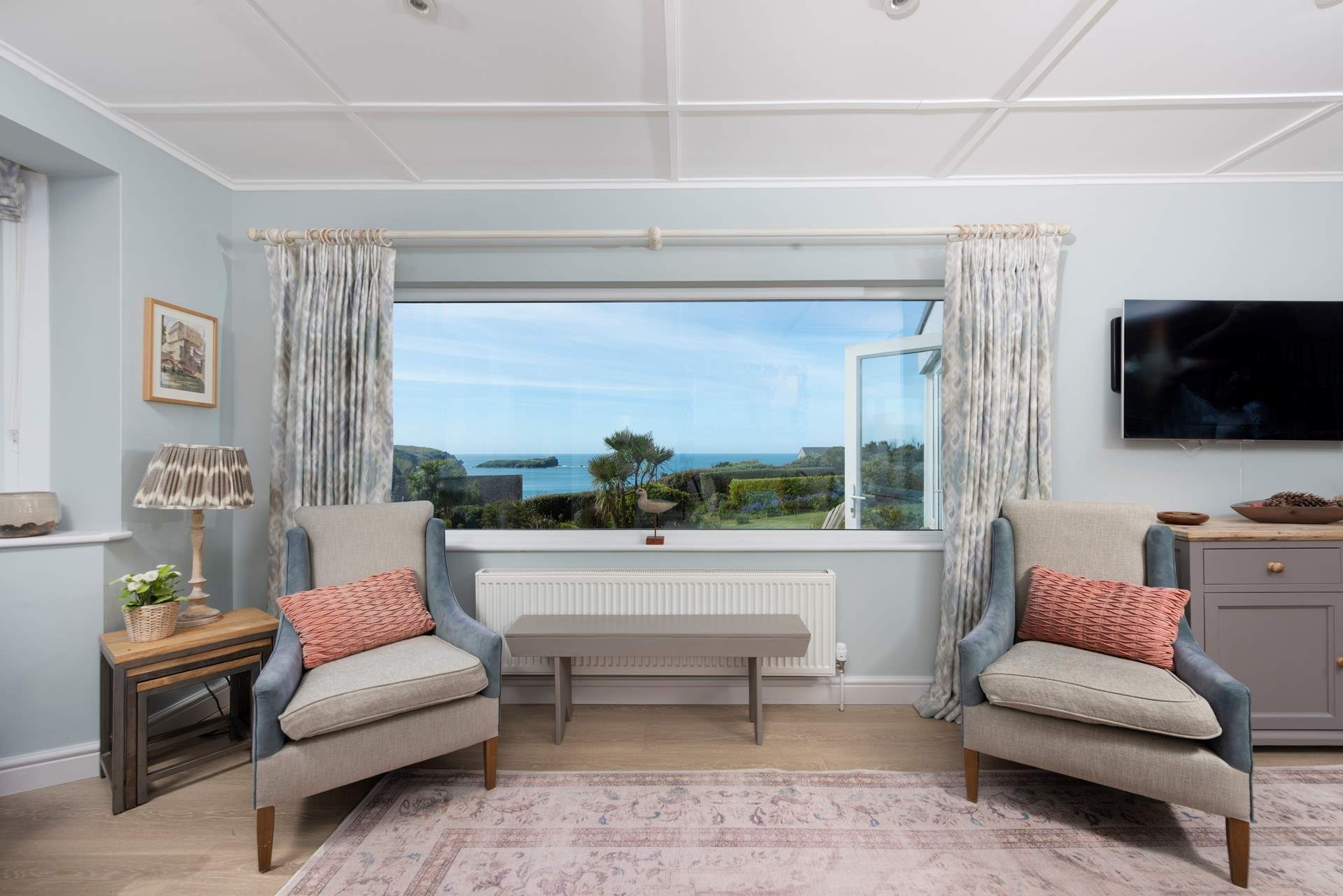 The sitting-room is on the seaward side of the home.