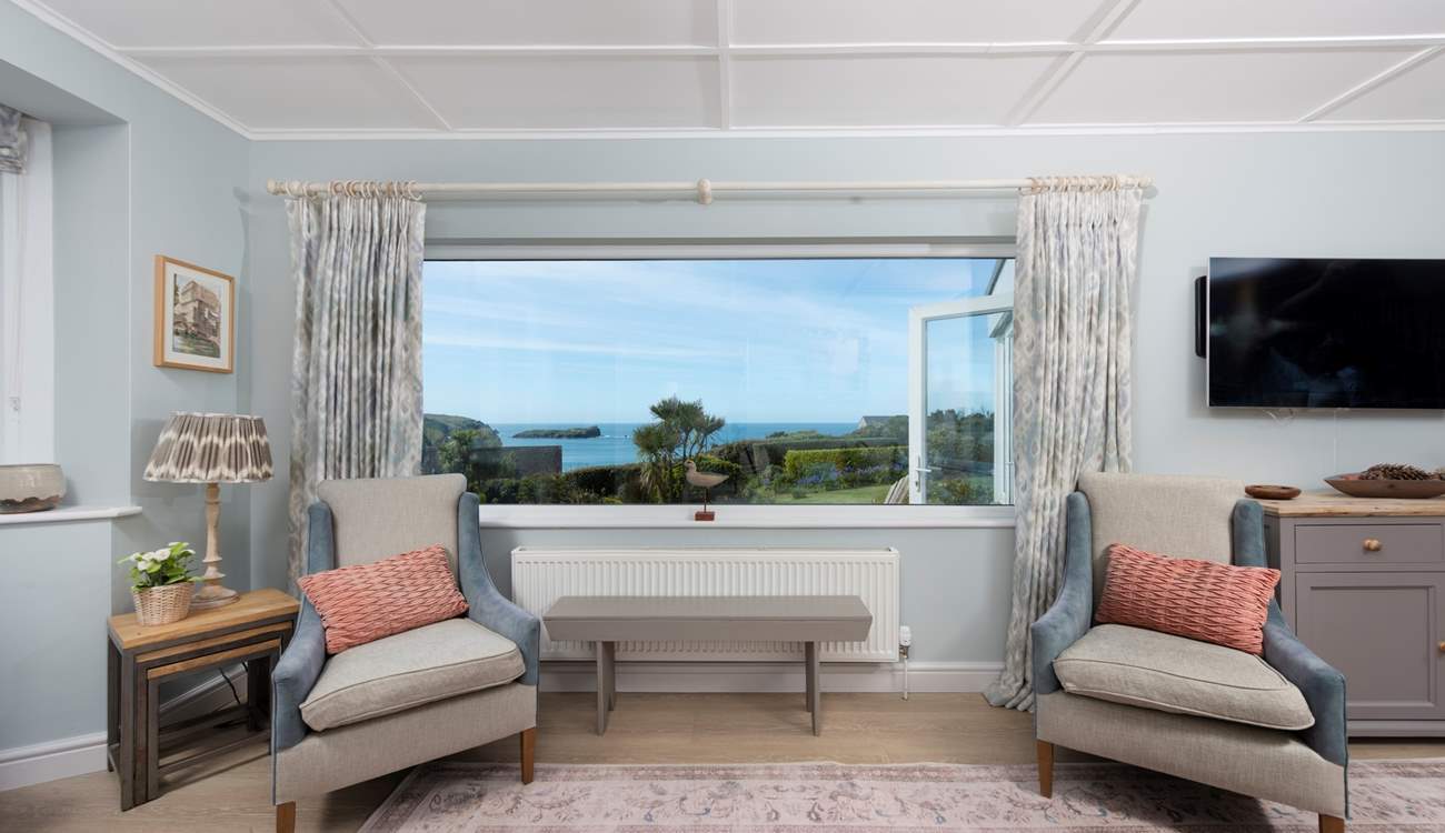 The sitting-room is on the seaward side of the home.
