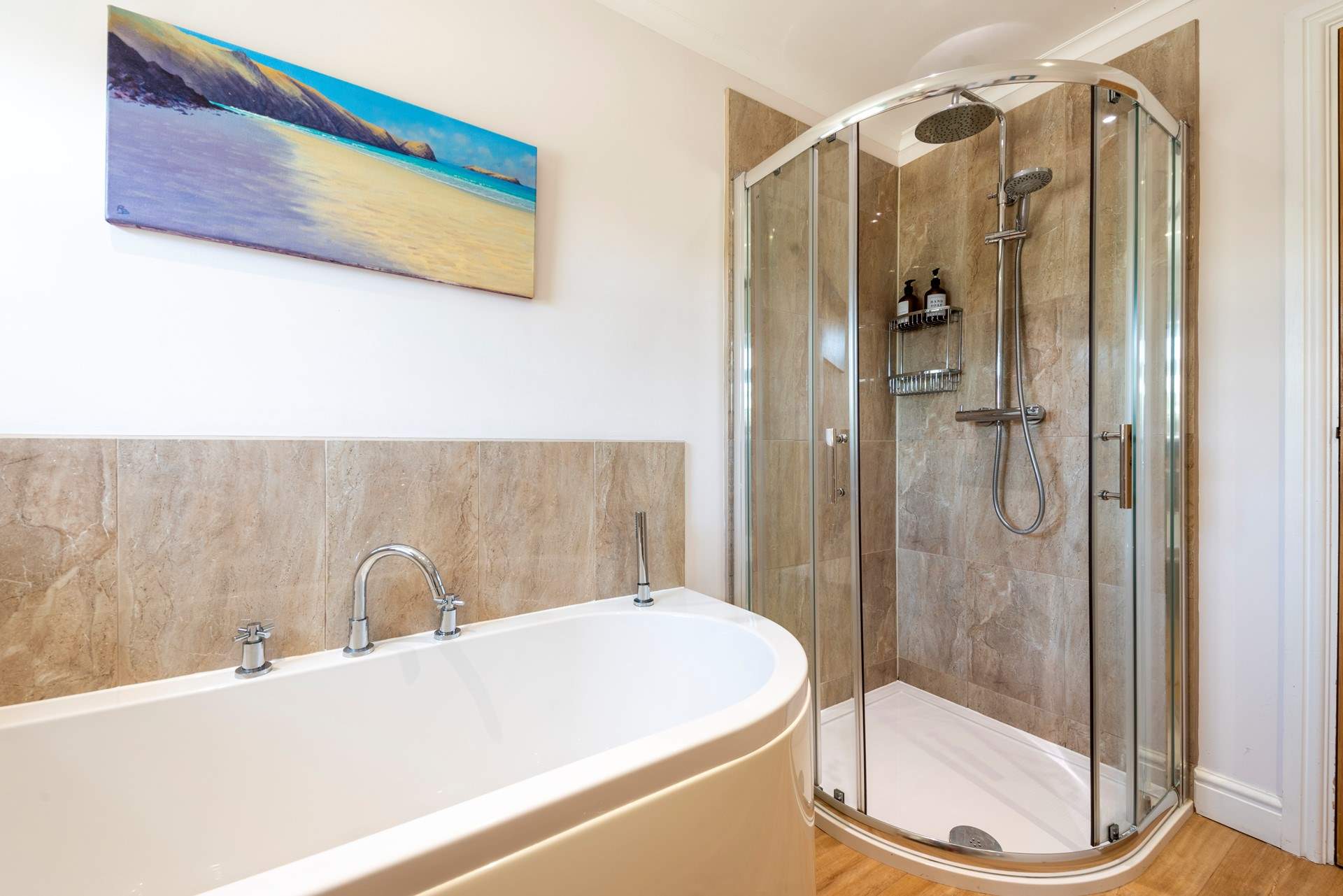 The family bathroom on the ground floor has a separate shower.