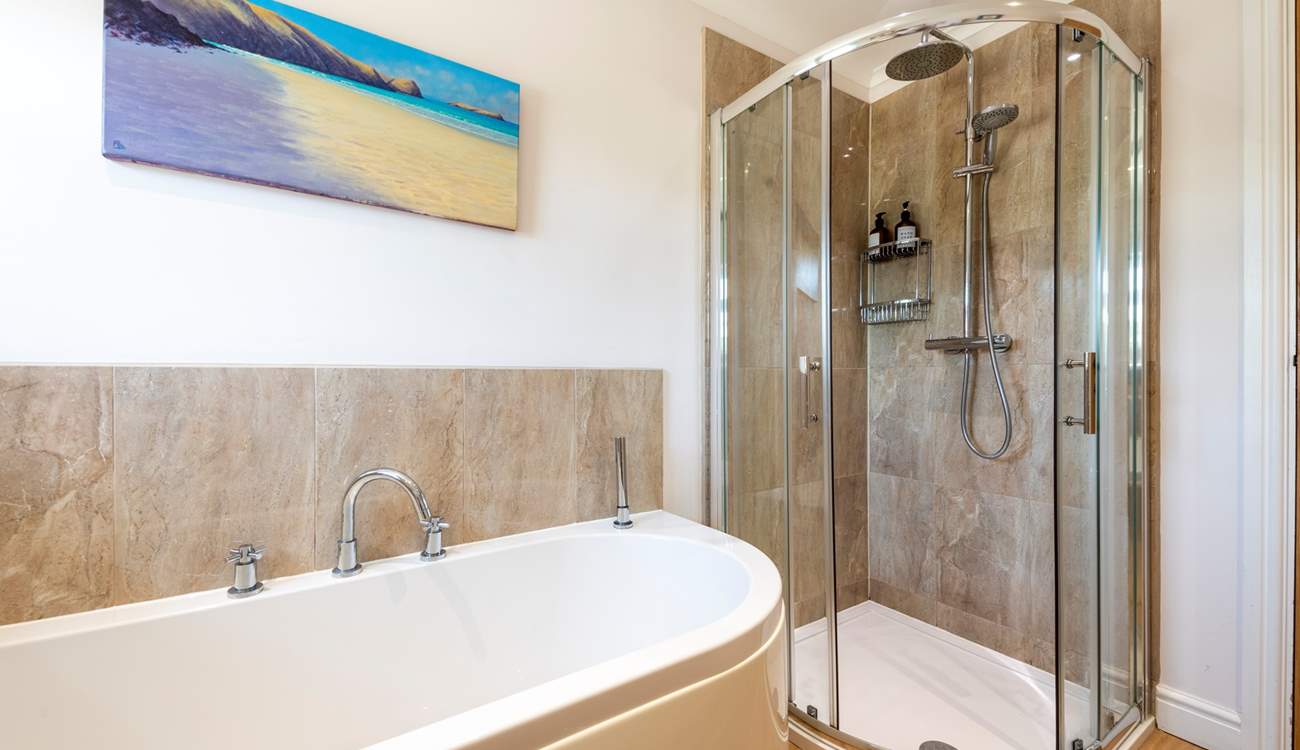 The family bathroom on the ground floor has a separate shower.