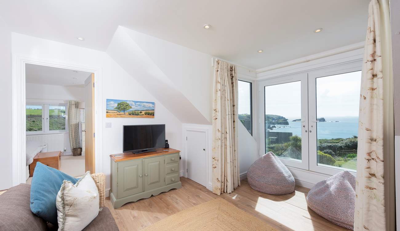 A lovely space for reading before bed beside the stars and the gentle lap of the ocean.