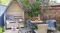 The secluded rear patio is ideal for al fresco dining.