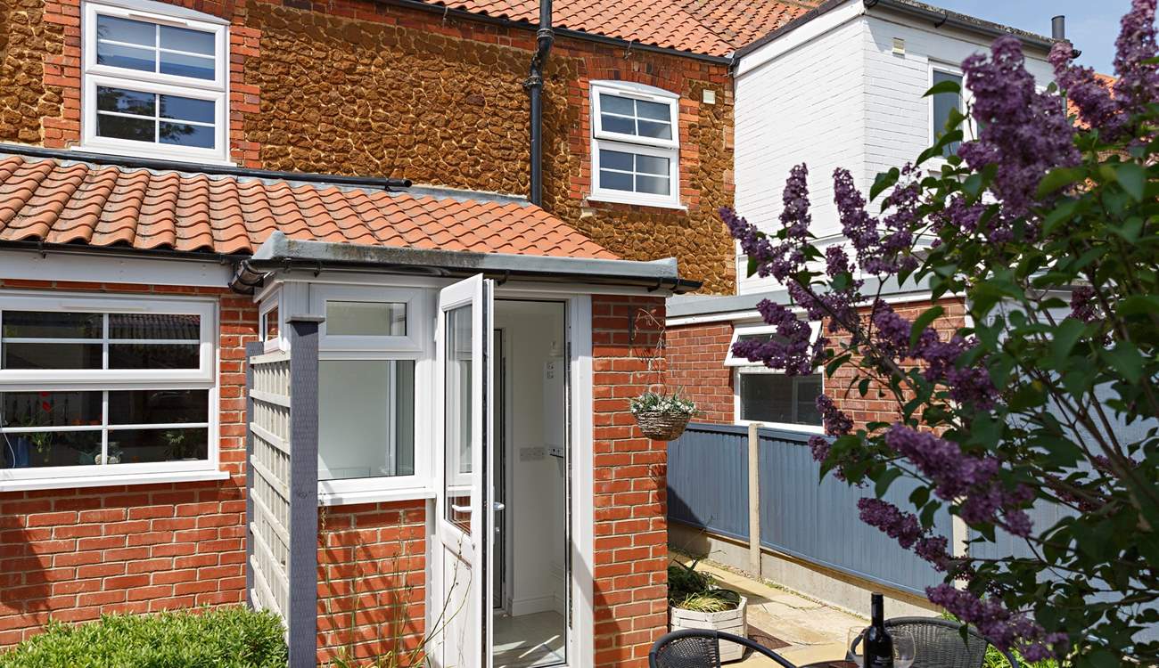 The rear door opens out onto the sunny patio. 