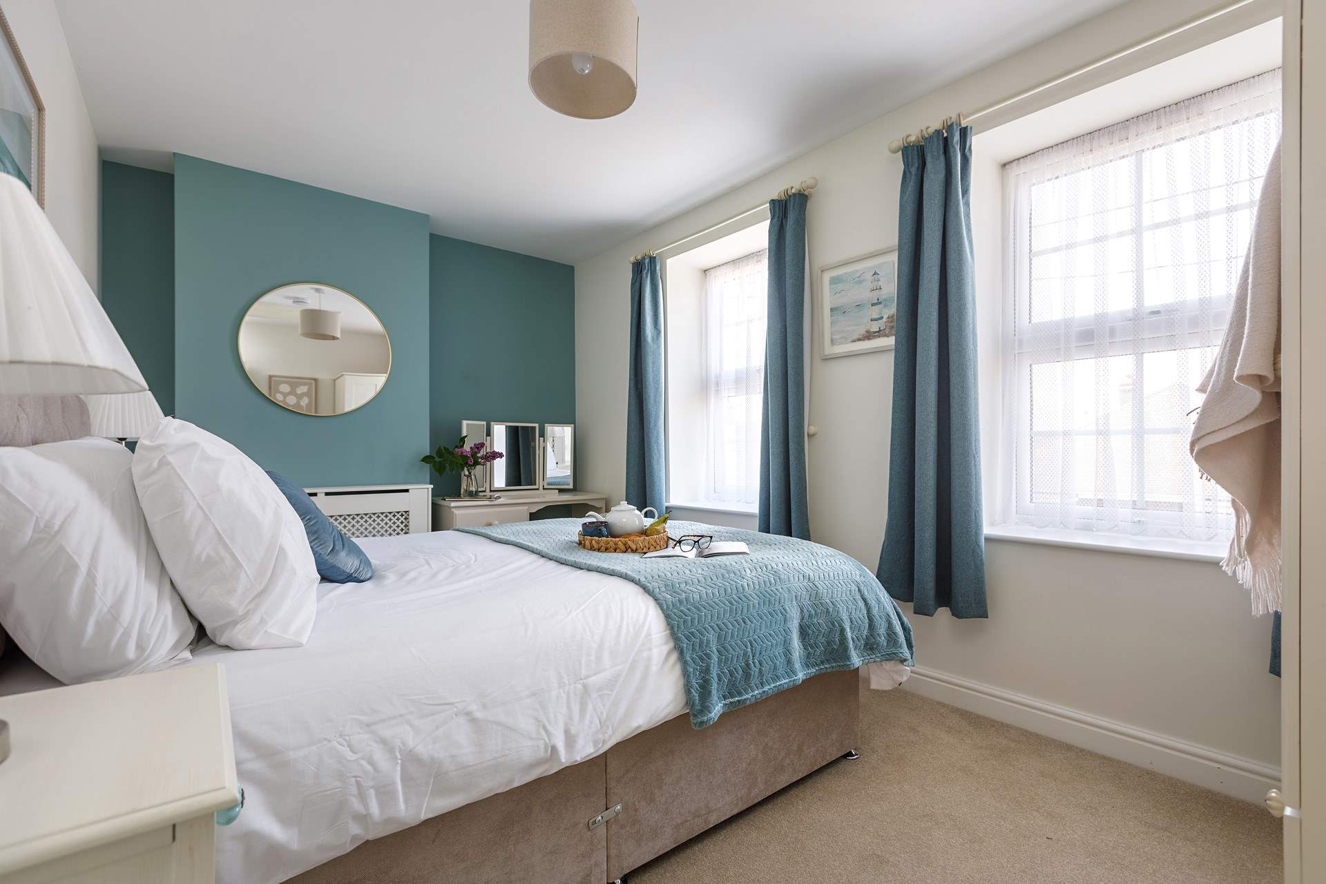 Beautiful linens await in the double bedroom. 
