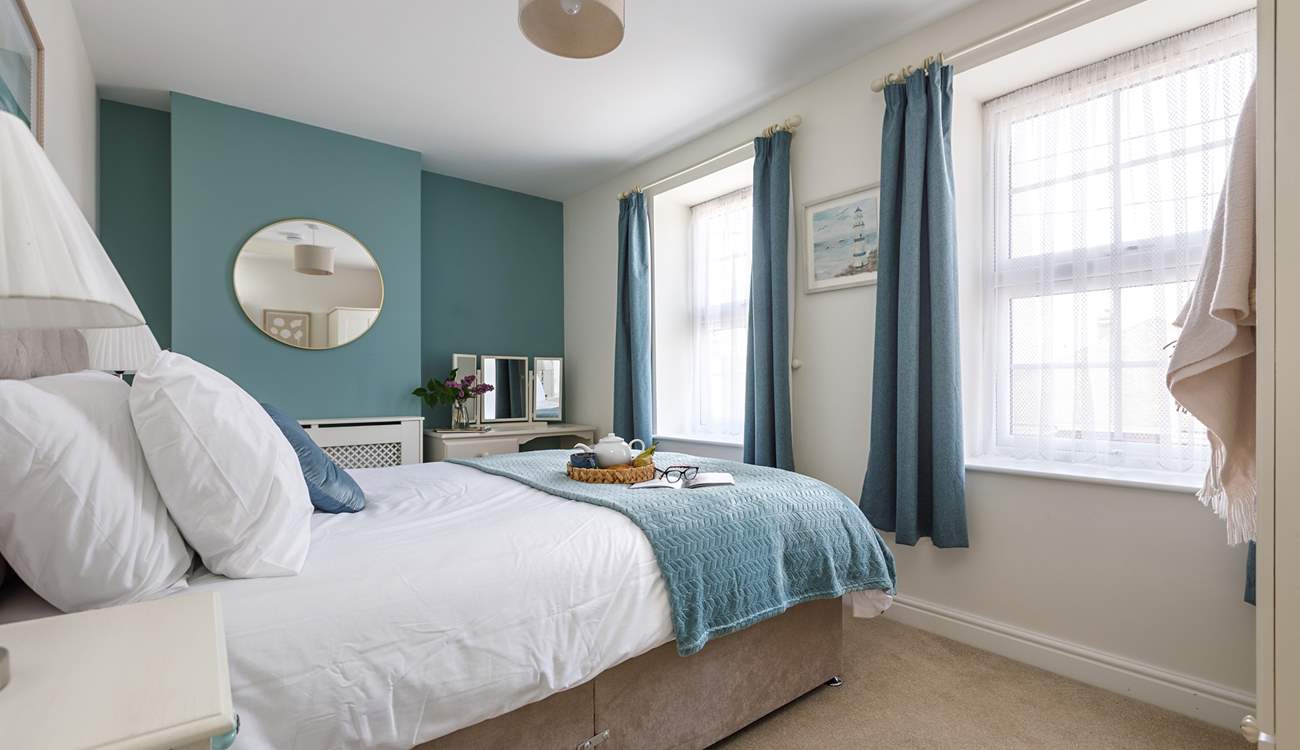 Beautiful linens await in the double bedroom. 